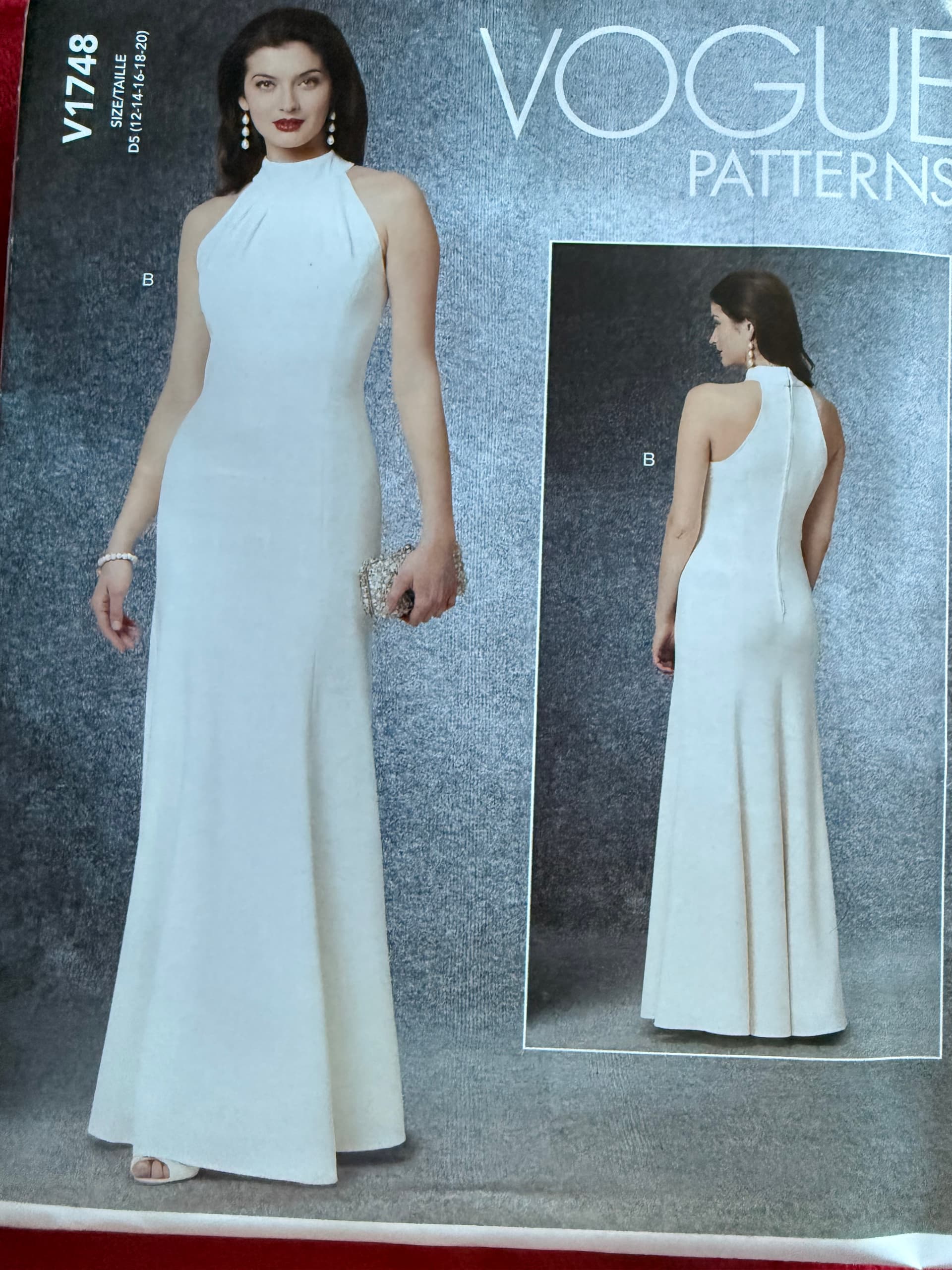 Sewing pattern Vogue 1748, Size 12-20. Elegant body hugging formal dress with high collar.