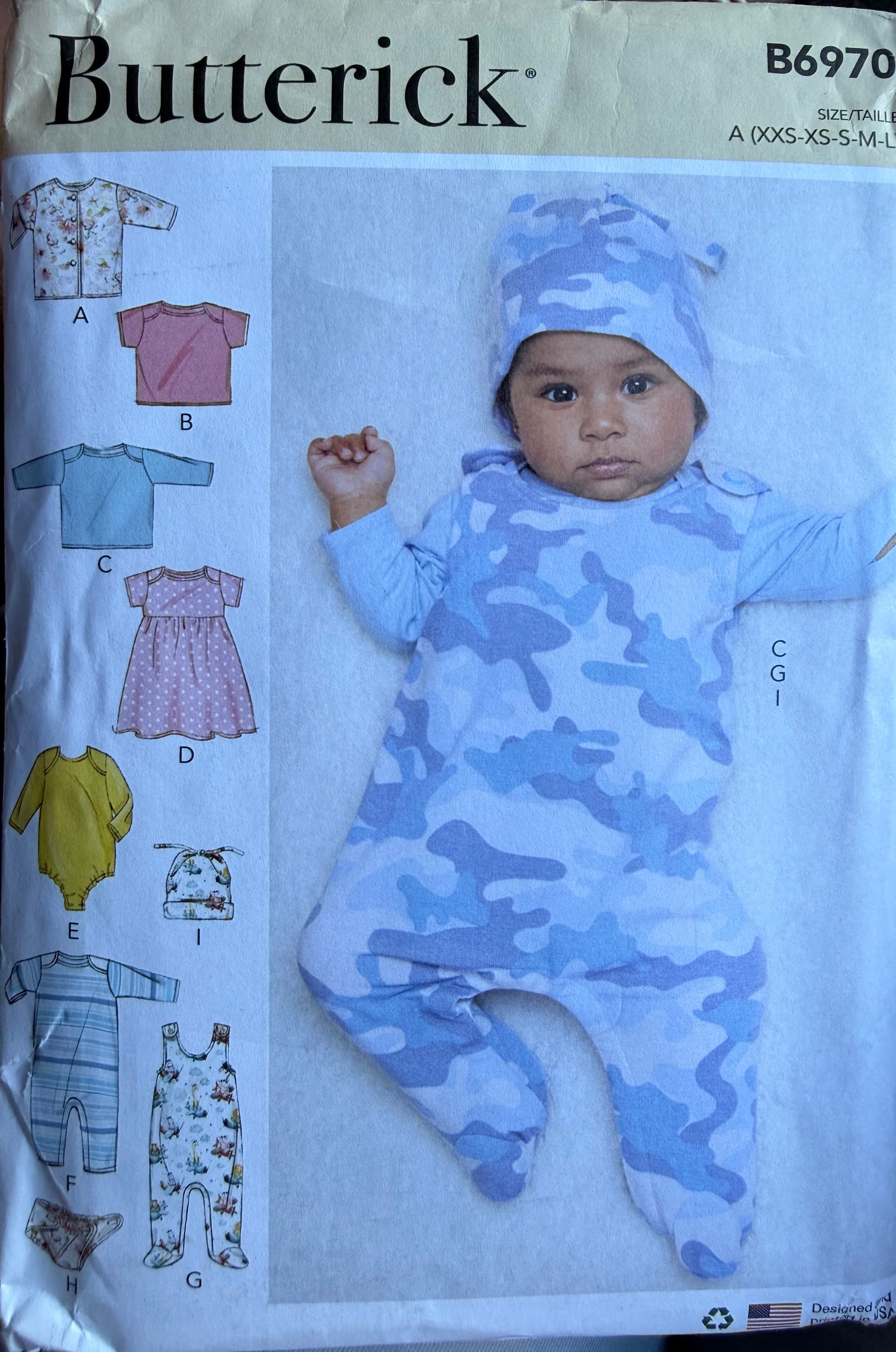 Butterick B6970 baby tops, jacket, dress, rompers, hat and diaper cover. Age new born to 18 months